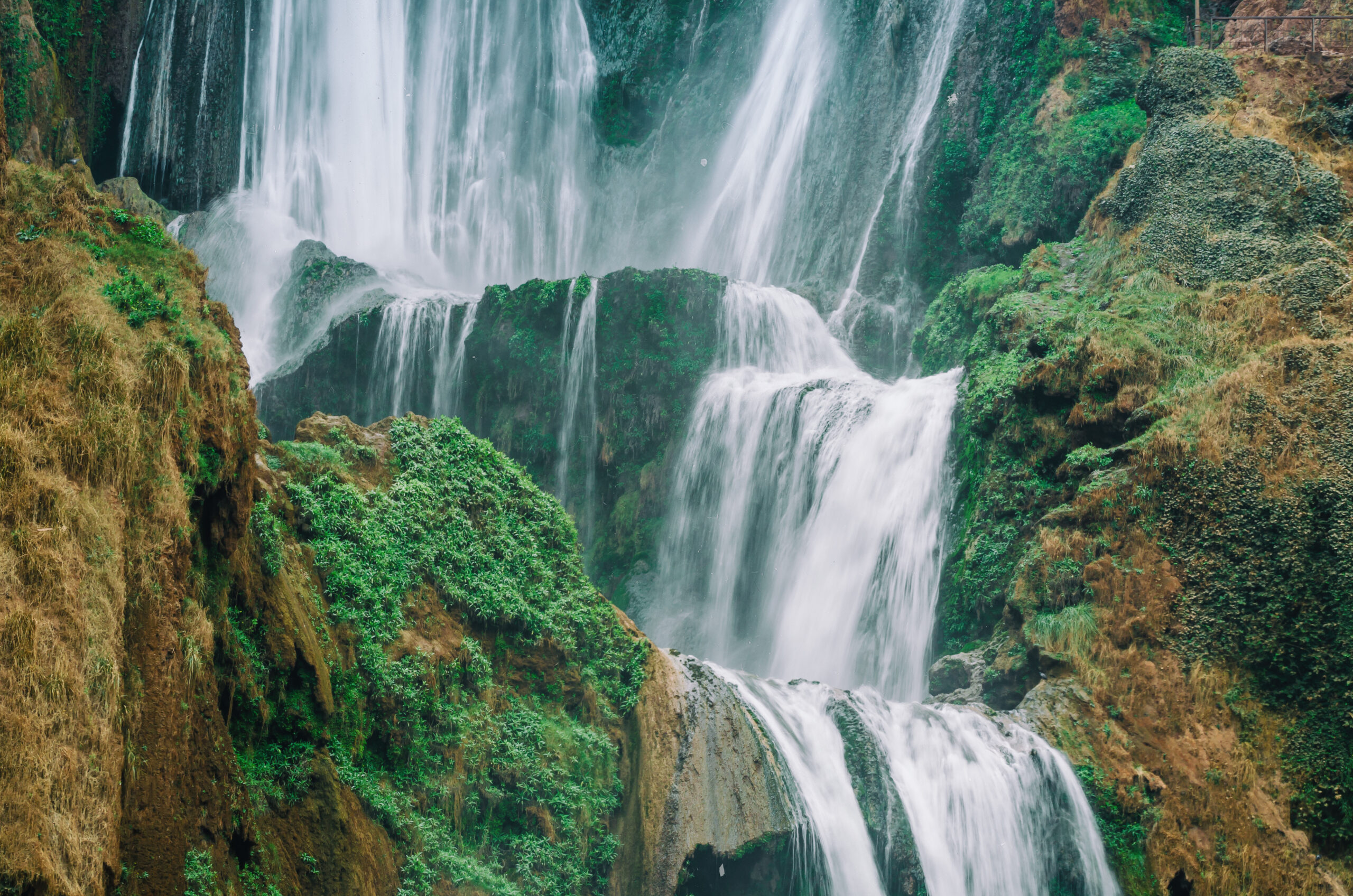 production-services-and-filming-in-marocco-waterfall-with-soft-flowing-water-large-colored-rocks